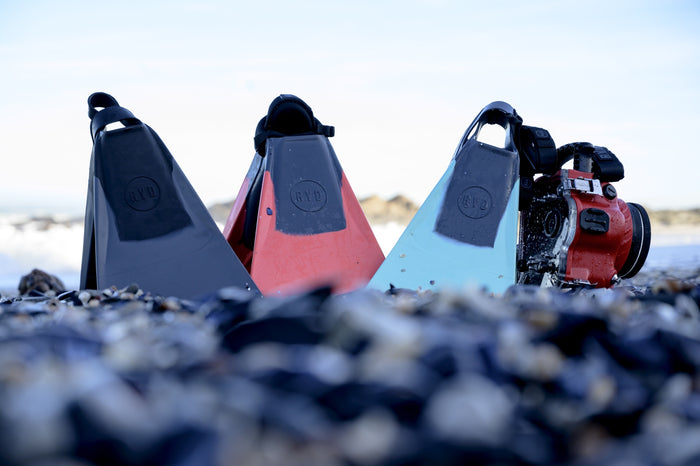 RYD True swim flippers in Grey, Coral and Aqua on the beach with an action camera