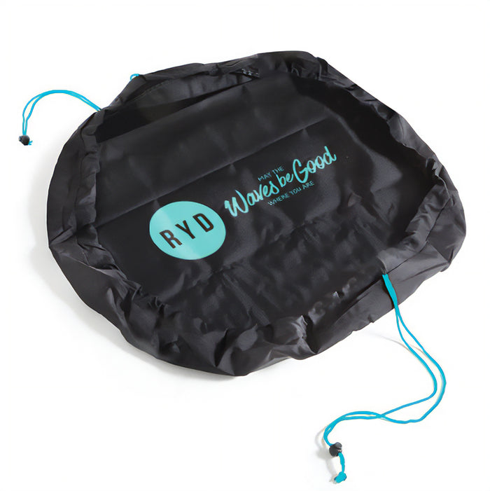 RYD Black Change Mat wetsuit bag laid open flat with teal RYD branding and drawstring