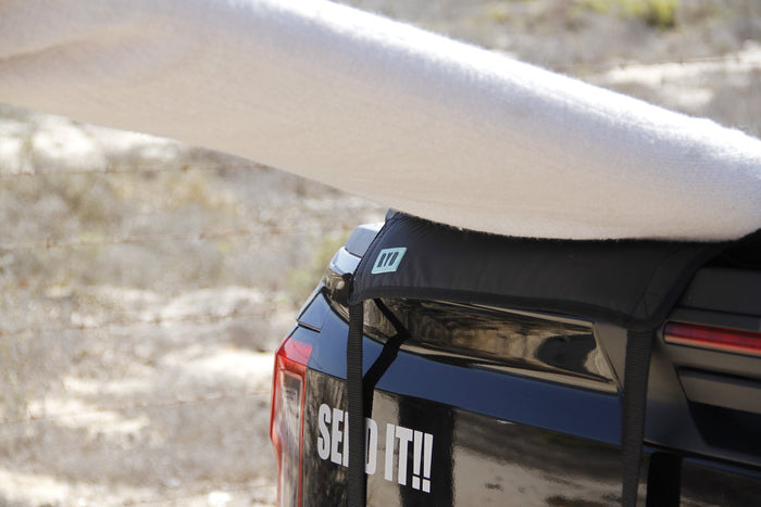RYD padded tailgate cover fitted over a bakkie tailgate with a board resting on it