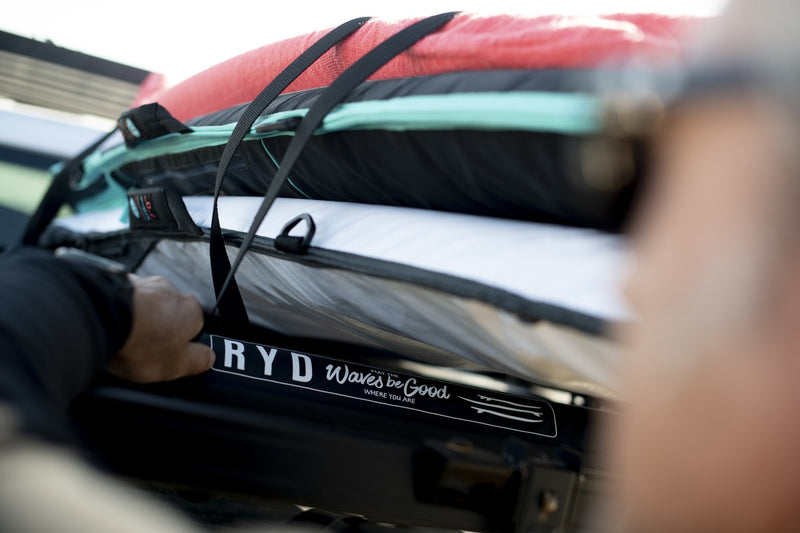 Close-up of stacked RYD Layback Range board covers racked on a bakkie tailgate