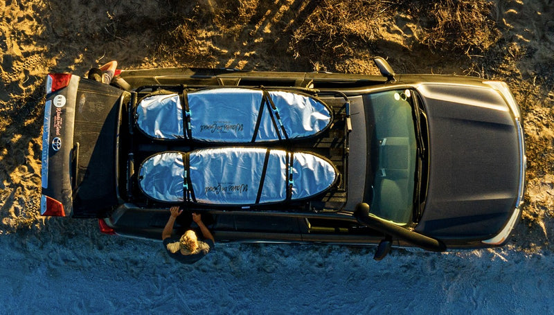 Aerial view of two RYD True Range Explore board covers strapped to a bakkie roof rack