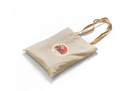 RYD Cream woven tote bag, angled view showing the strap and gusset